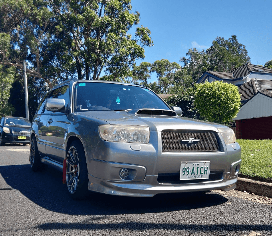 Silver Subaru Forester on the street outside the workshop